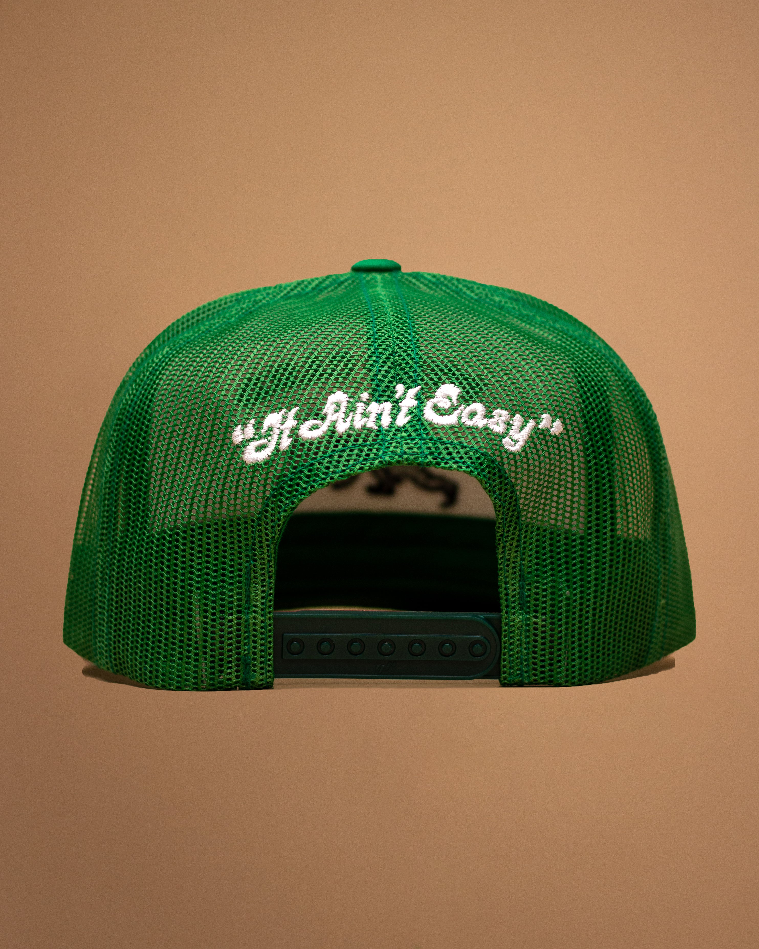 Wild Card Boxing Original Logo "It Ain't Easy" Trucker Hat - White/Green